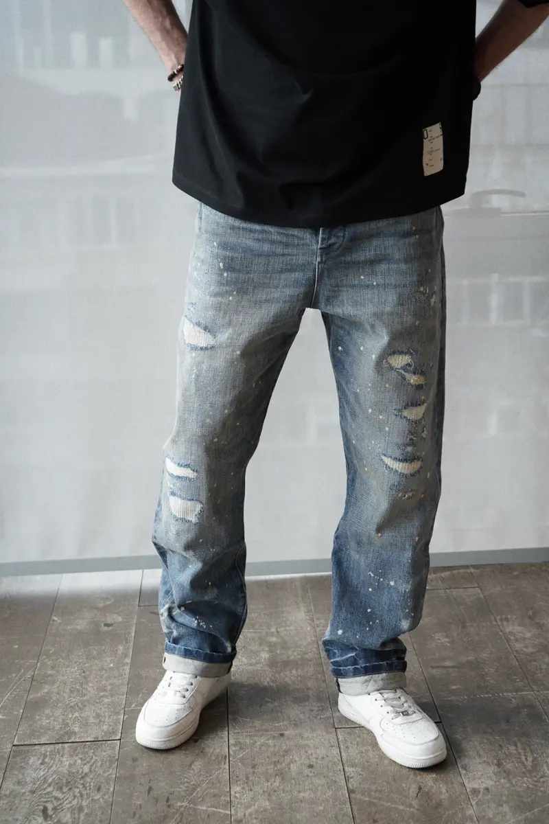 relaxed fit denim jeans with selvedge. dark destroyed wash